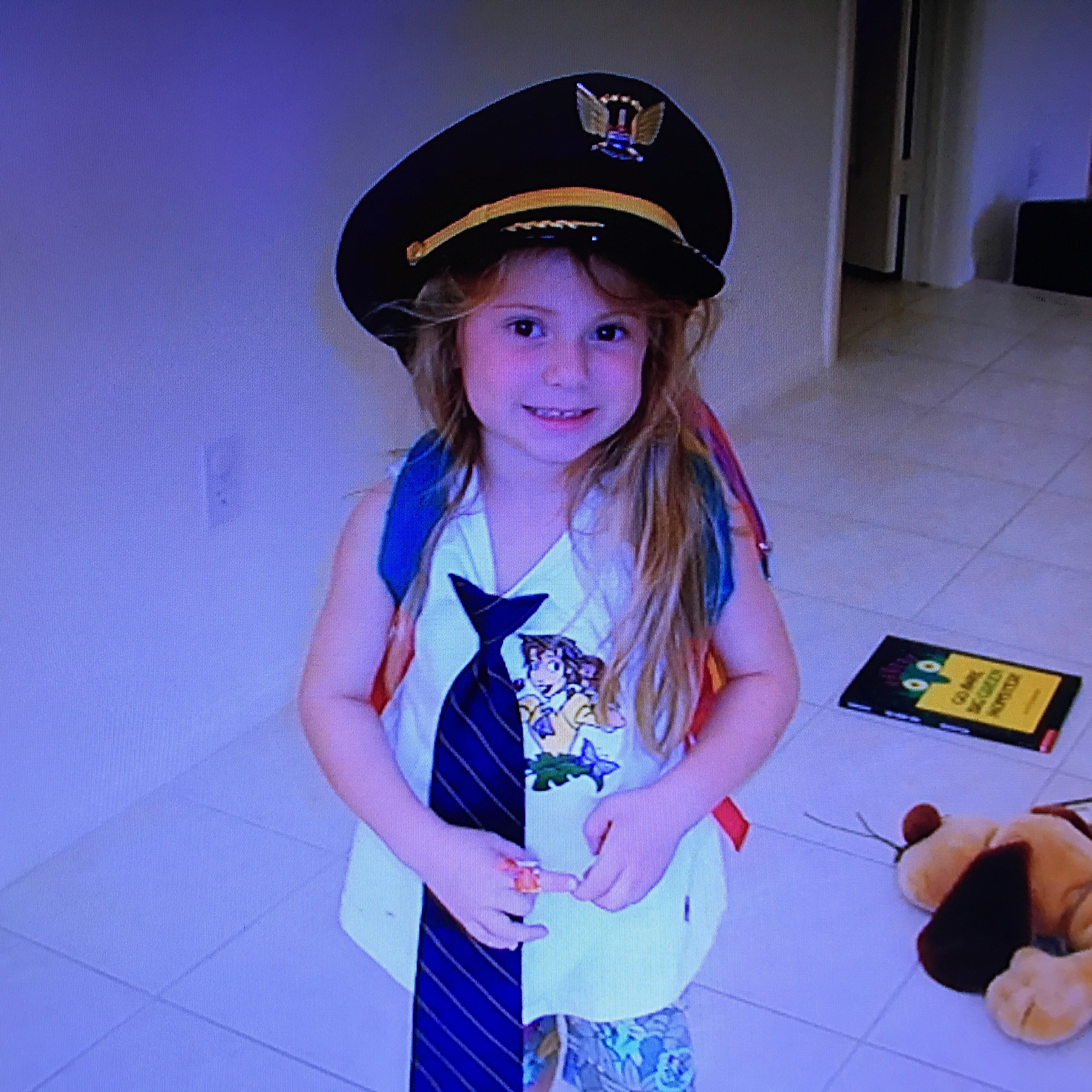Sarah Tanis wearing her dad’s pilot uniform.